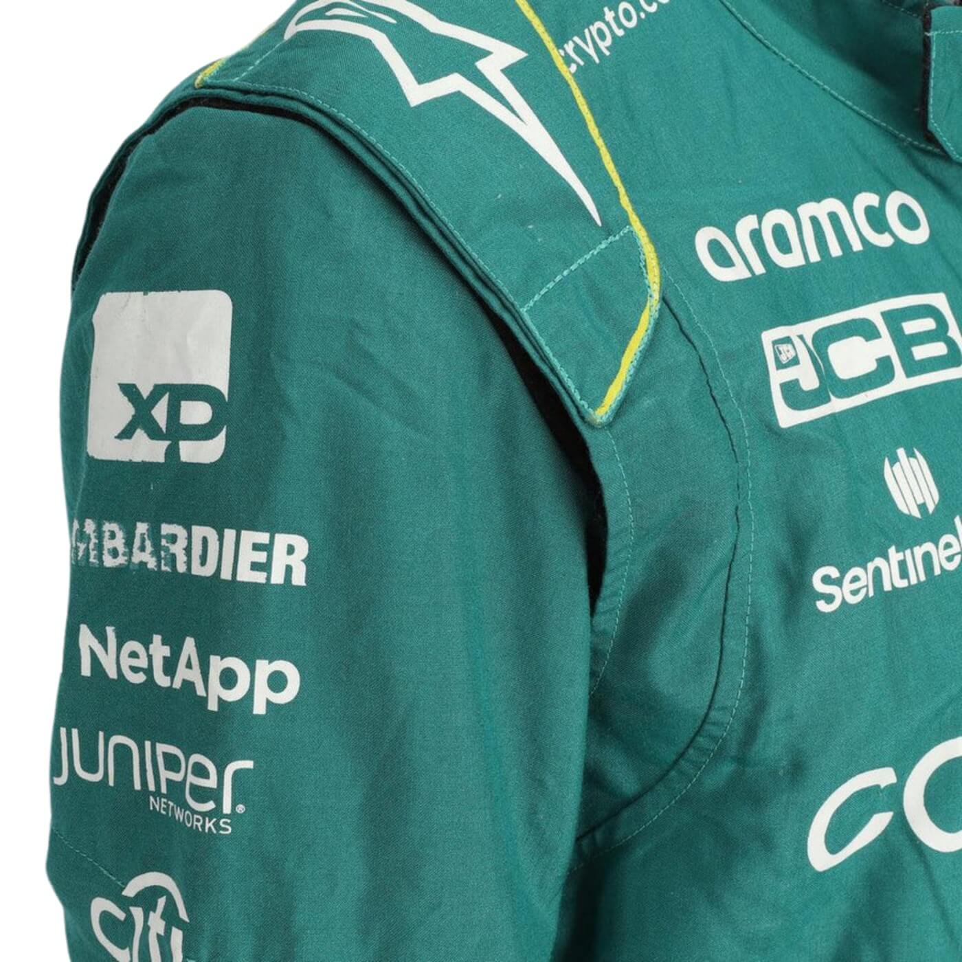 Close-up of the fabric and stitching on Fernando Alonso’s 2023 F1 racing suit, capturing the high-quality material and detailed sponsor branding, designed for durability and race-ready functionality.
