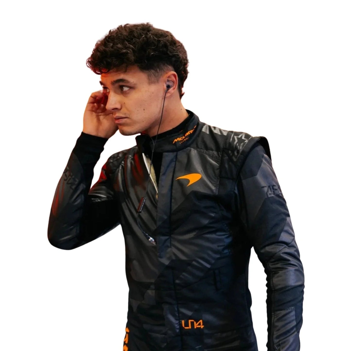 Front view of the 2025 McLaren F1 livery reveal racing costume worn by Lando Norris featuring a sleek matte black base with bold orange logos and driver initials (LN4) in neon orange.