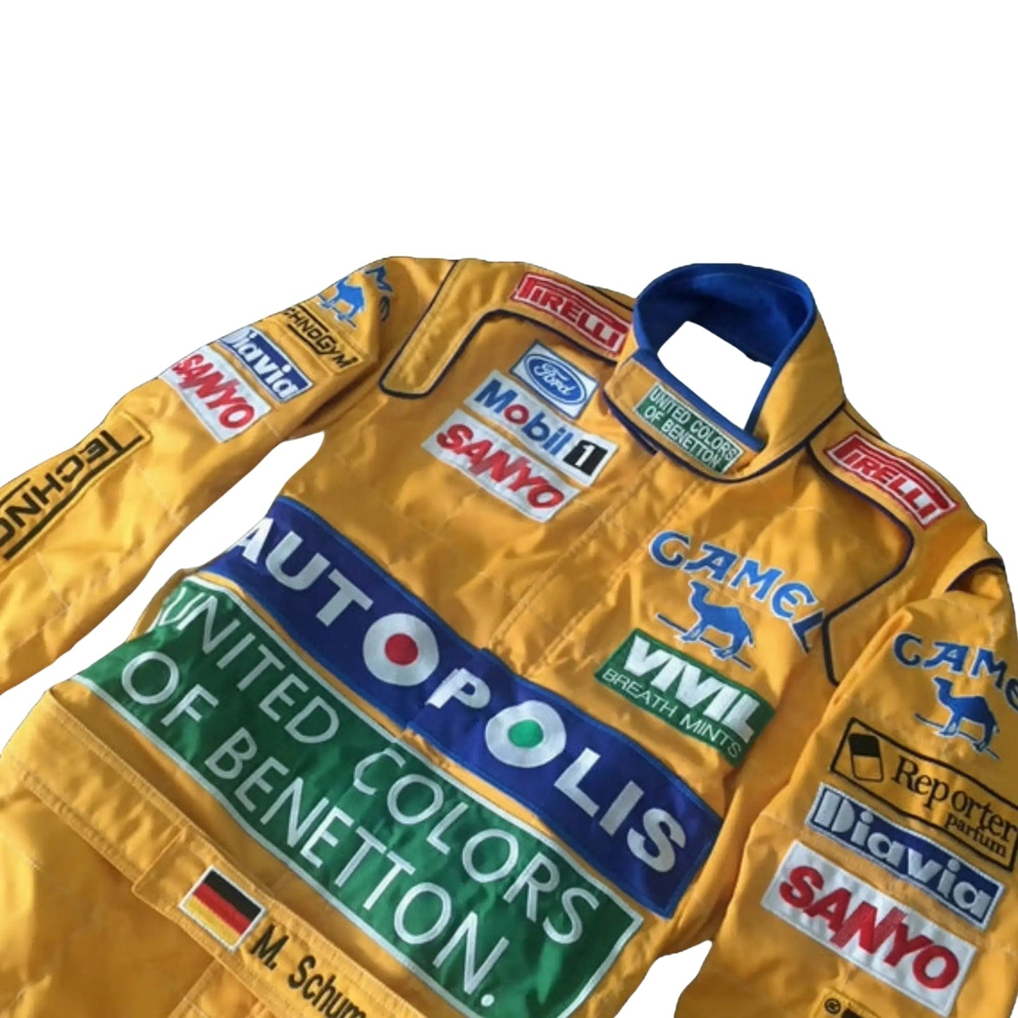 Close-up of the embroidered logos, stitching details, and breathable fabric textures from Michael Schumacher’s 1992 Benetton F1 race suit.