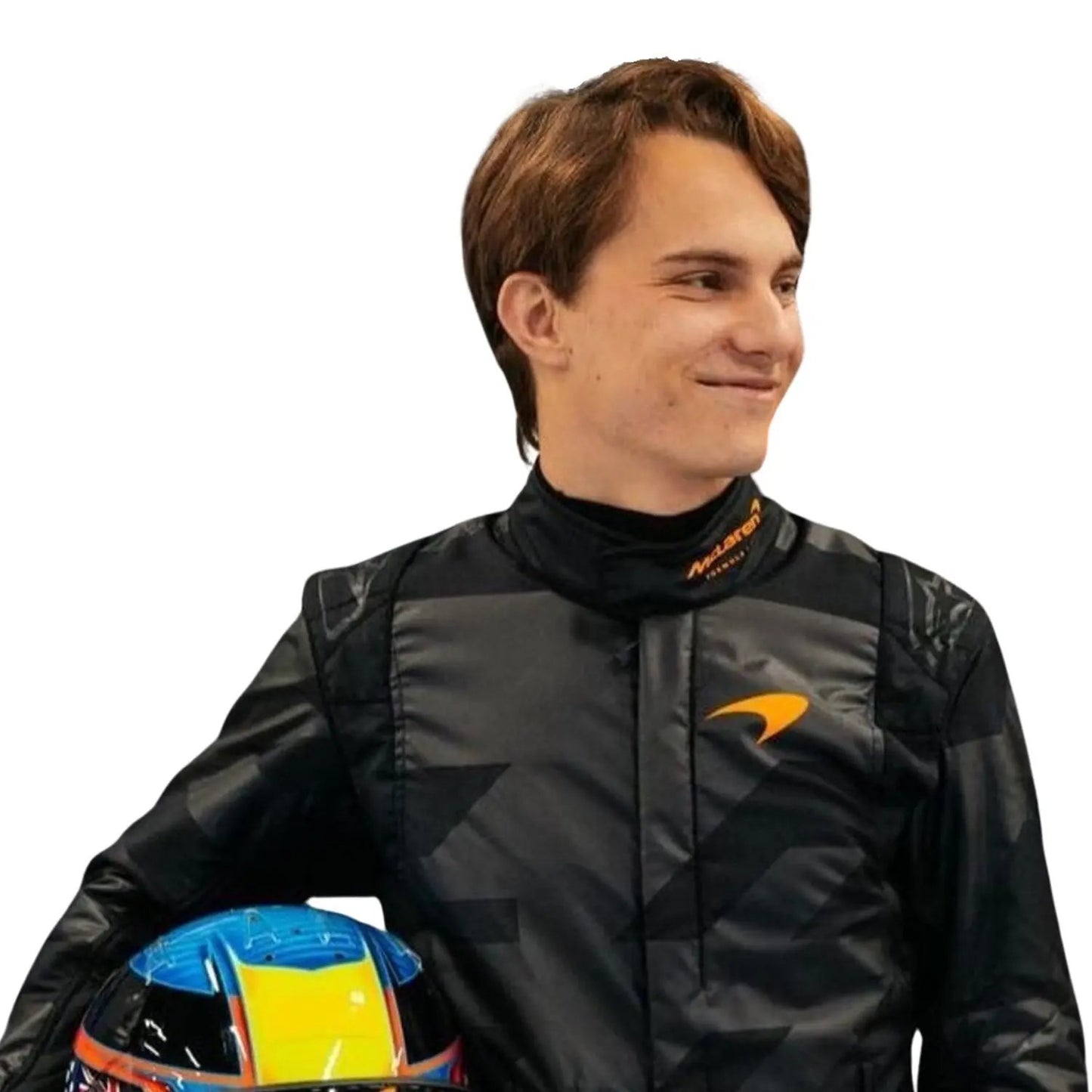 Close-up of Piastri holding custom-designed helmets — Piastri with a high-gloss blue-yellow-red helmet—contrasting the matte black suit.