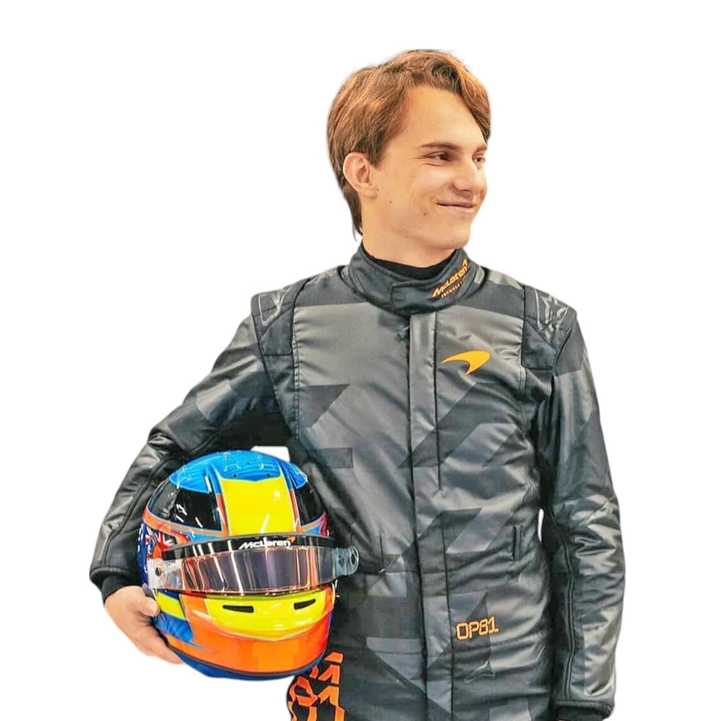 Close-up of Piastri holding custom-designed helmets — Piastri with a high-gloss blue-yellow-red helmet—contrasting the matte black suit.