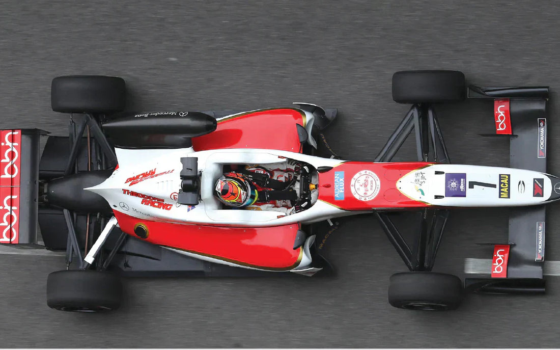 "Professional Formula race car and driver in racing suit ."