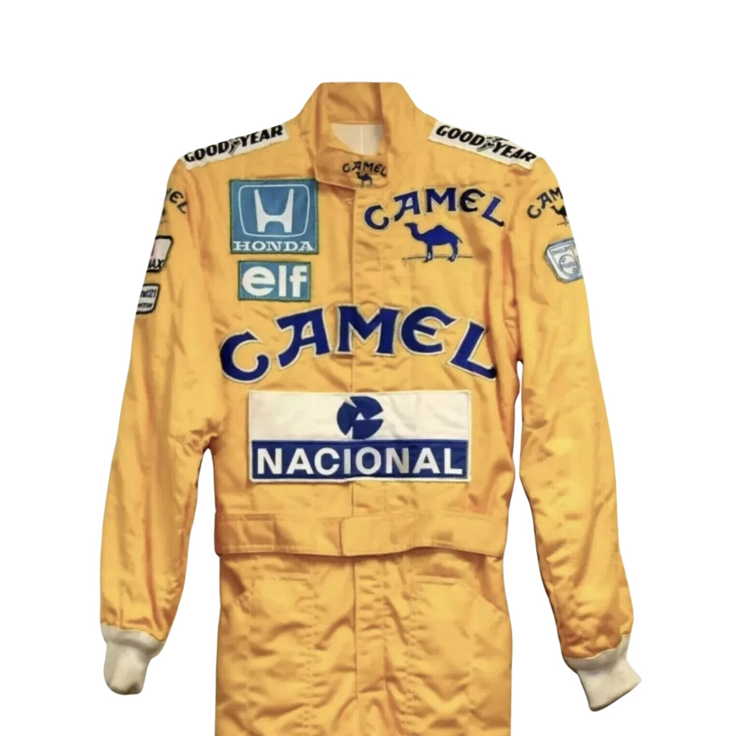 Close-up shot of the 1987 F1 racing suit worn by Ayrton Senna, highlighting premium stitching, fabric texture, and colorful sponsor logos.
