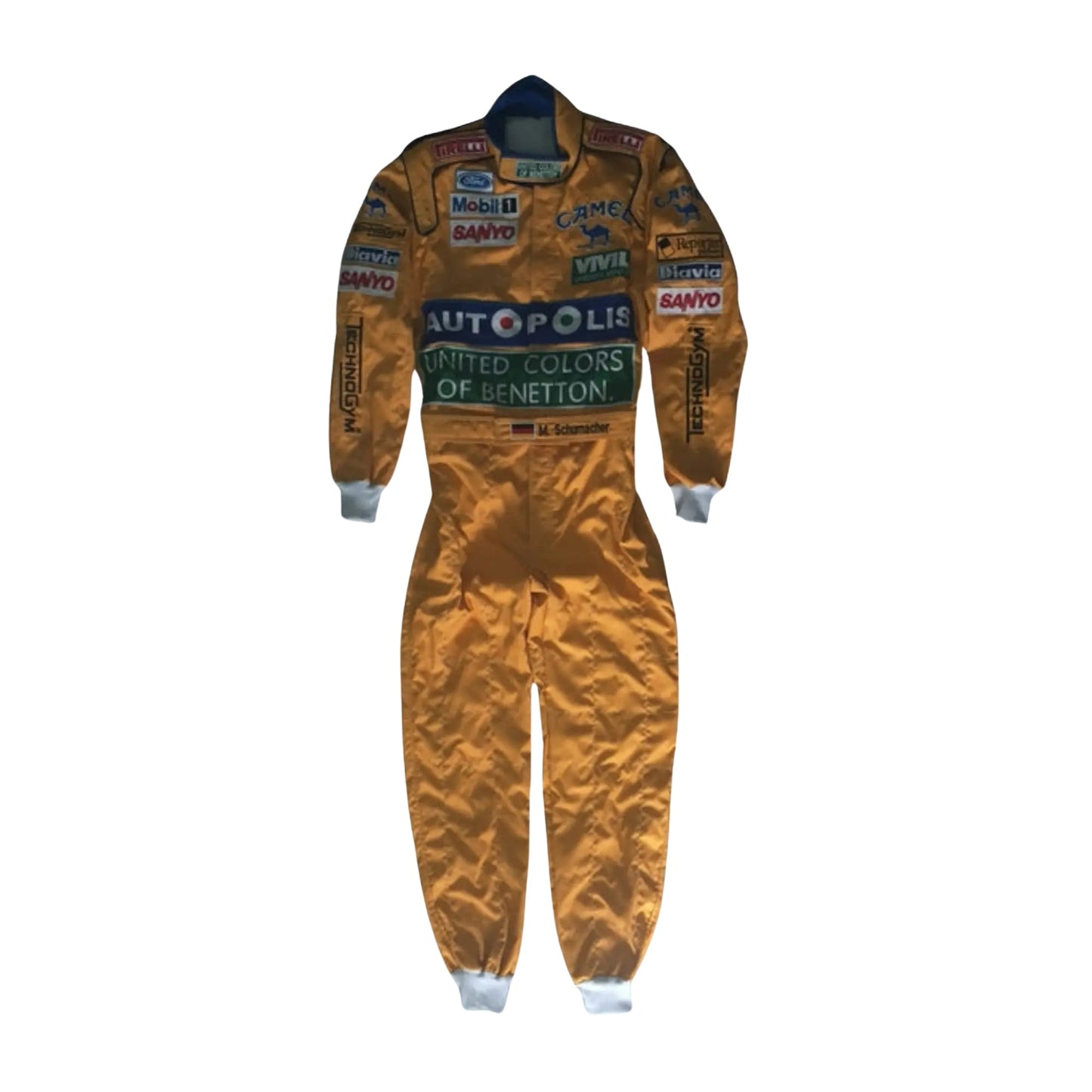 Front view of Michael Schumacher's 1992 F1 racing suit featuring deep green with yellow accents, signature Benetton sponsorship, and classic zip-front design.