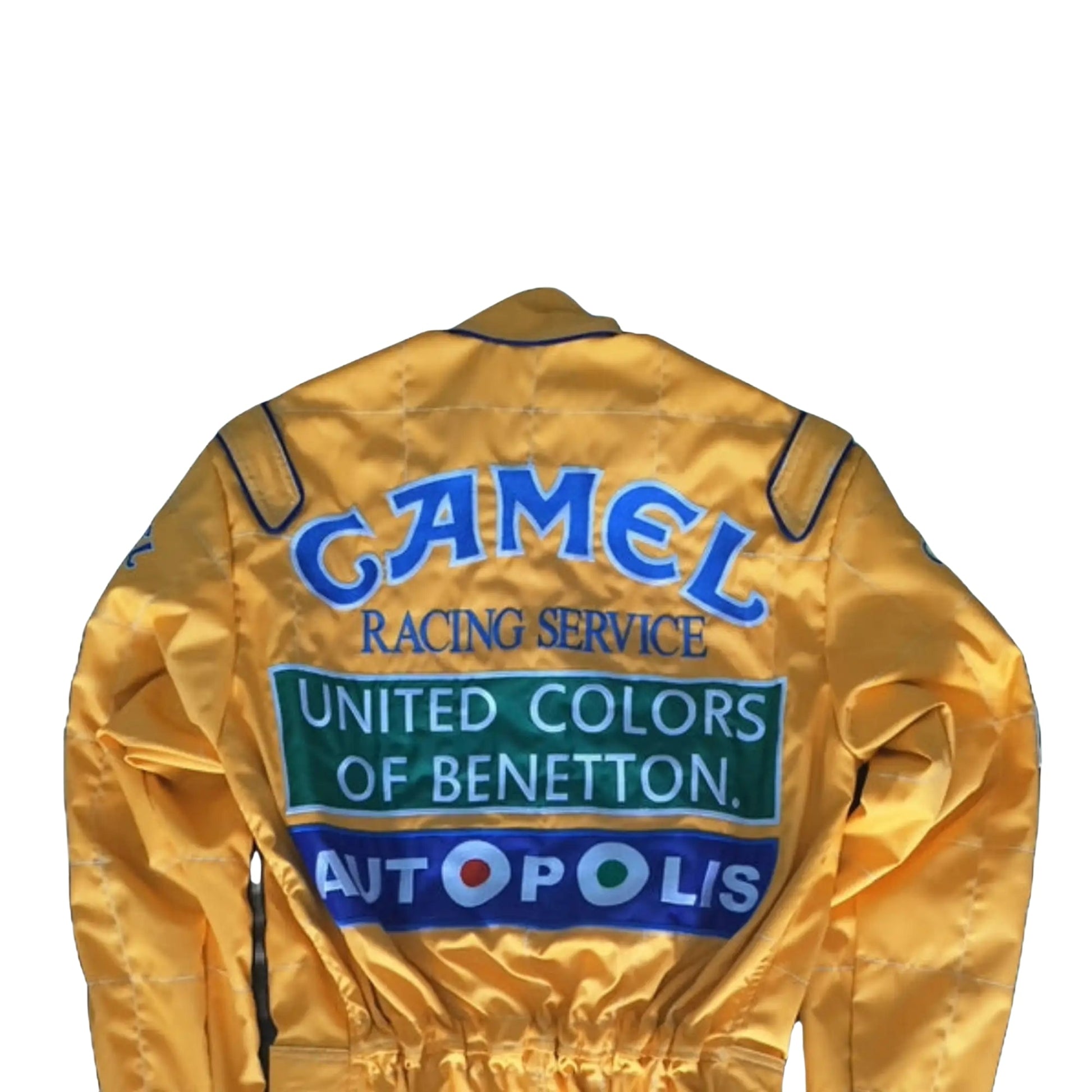 Back side of the 1992 Formula 1 suit worn by Michael Schumacher, showcasing era-specific sponsor logos and reinforced fabric seams for safety.