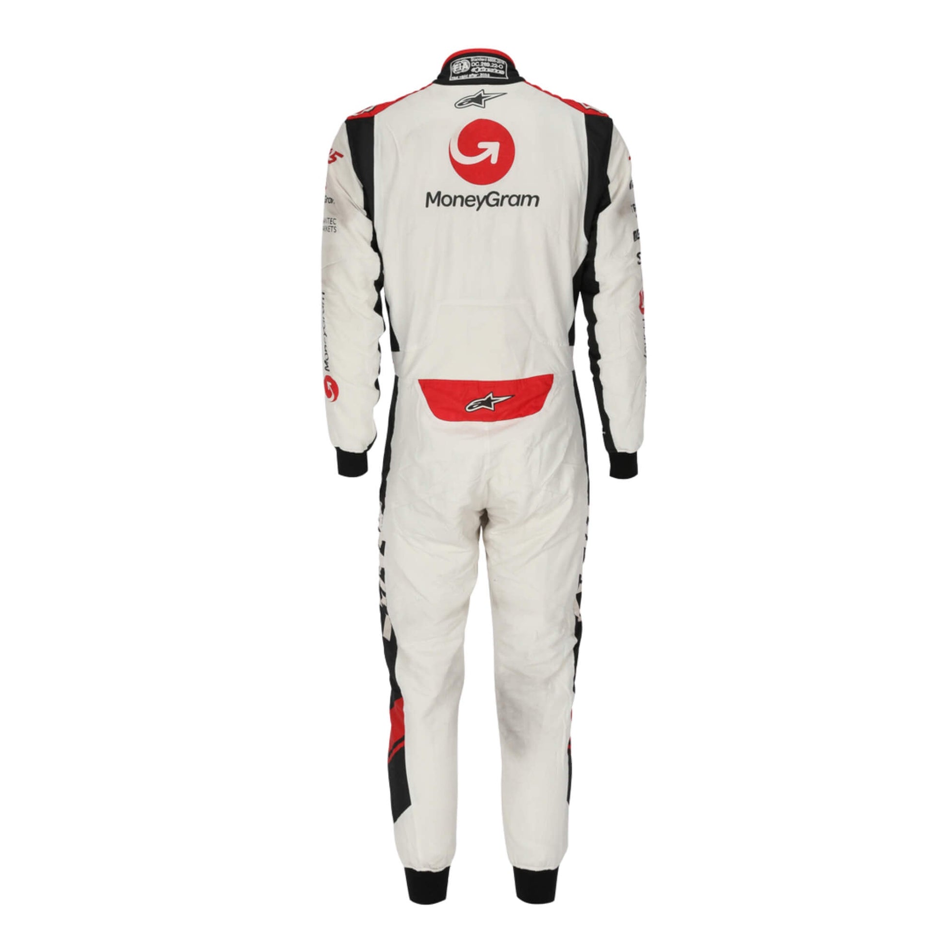 Back view of Kevin Magnussen’s 2017 signed F1 racing suit, highlighting sponsor embroidery and aerodynamic design for Formula 1 racing.