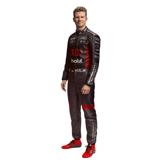 nico hulkenburg wearing a black and red 2026 f1 racing suit with Audi logo on a white background speedxgear